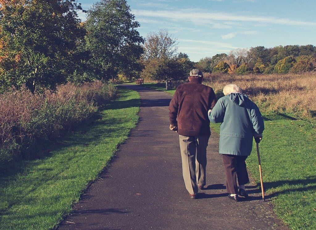 Older couple walking on a path