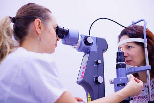 Woman having her eyes examined
