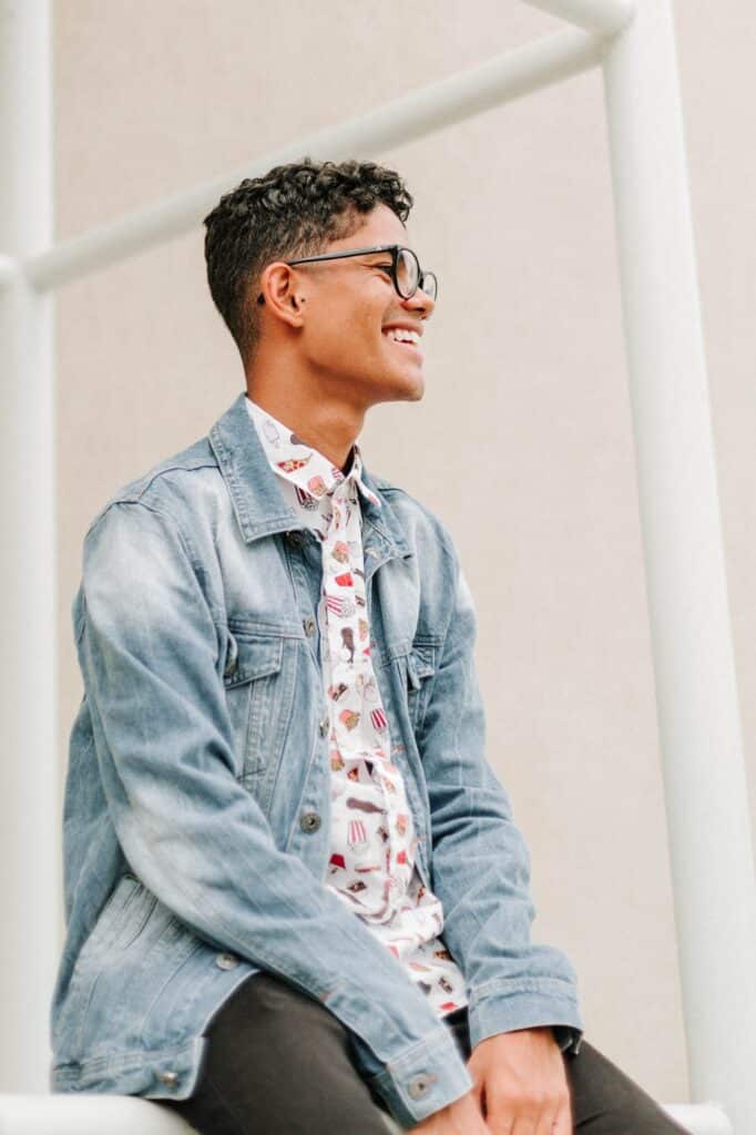 Young man sitting outside